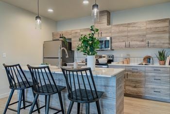 Open kitchen with tile backsplash